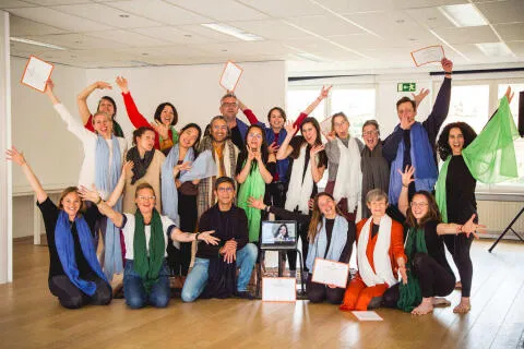 Group of people showing there certificates