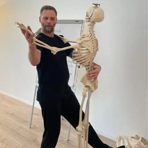 A man dancing with skeleton