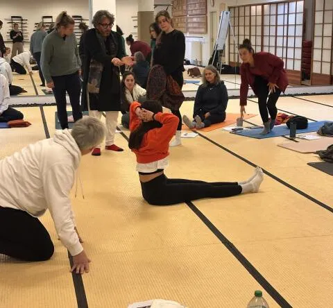 people participating in a yoga teacher training or workshop
