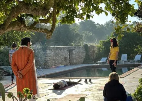 A small group of people practicing yoga