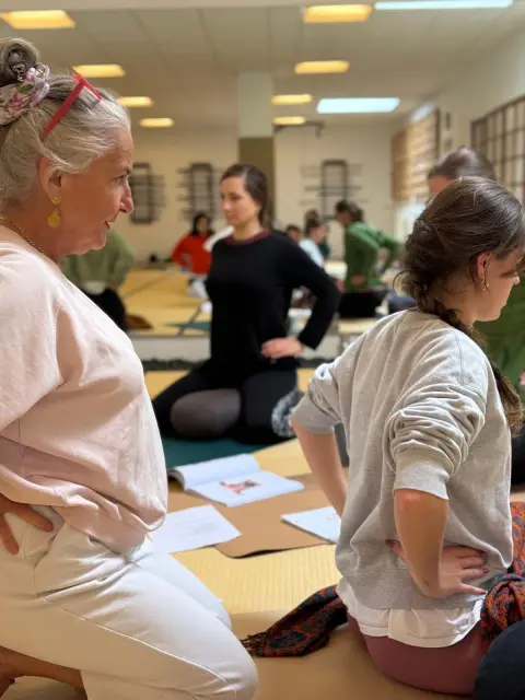 A group of people doing yoga